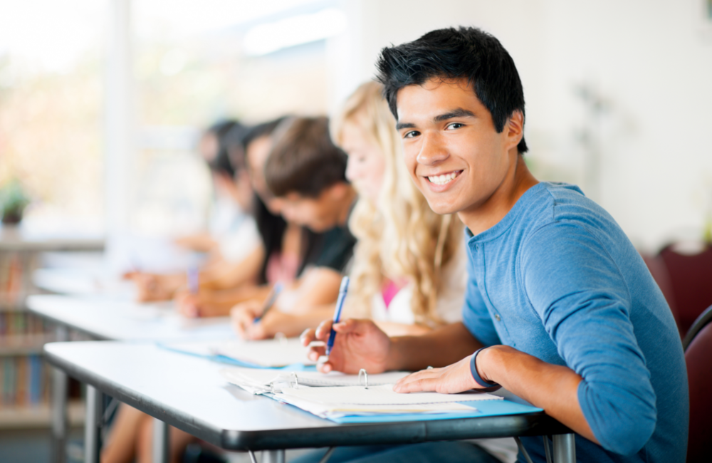 student at desk doing school work