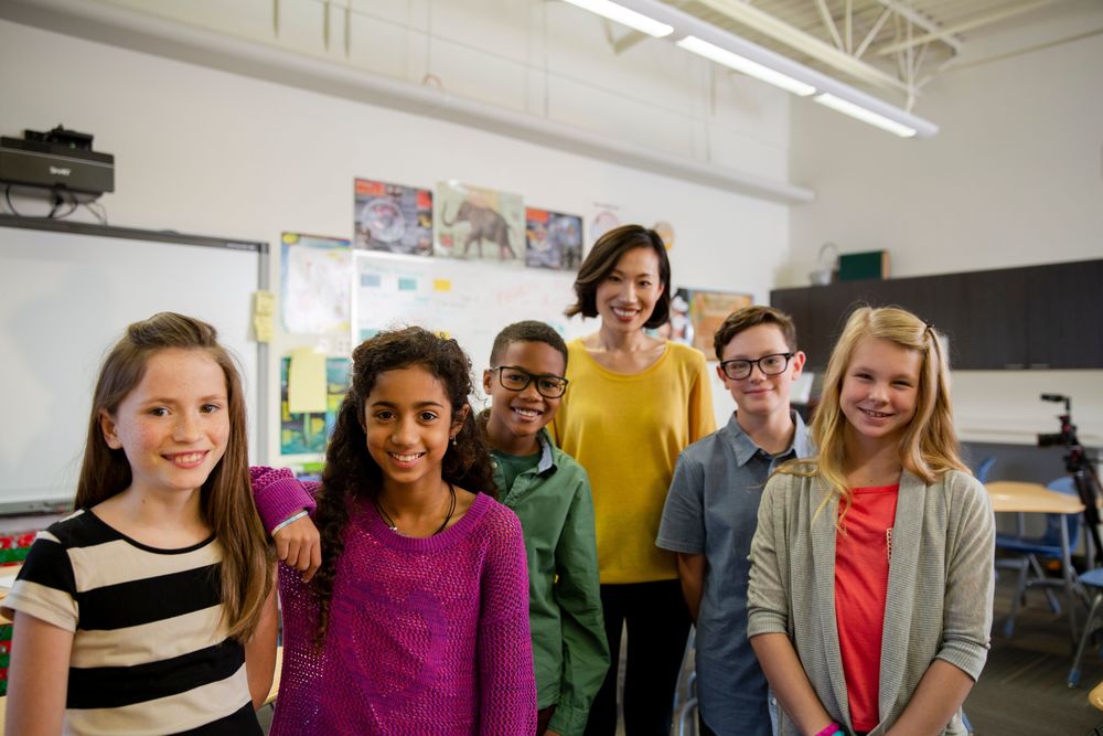students with teacher in classroom