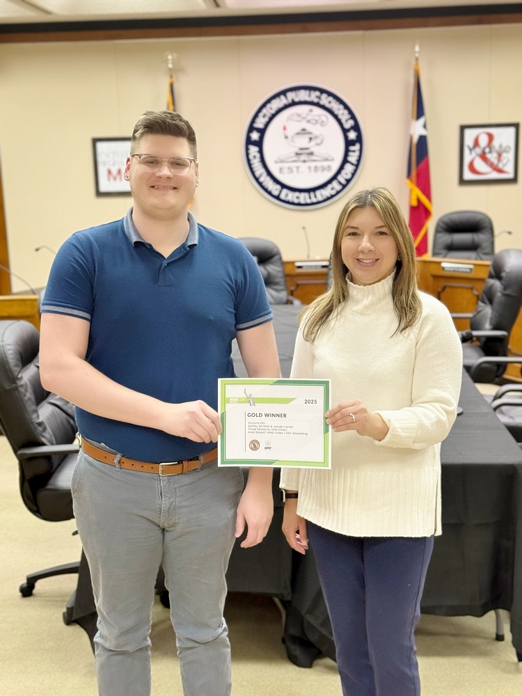 smiling at camera with certificate