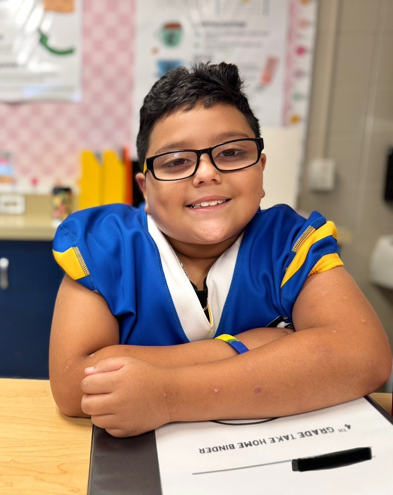 Male student sitting at a desk