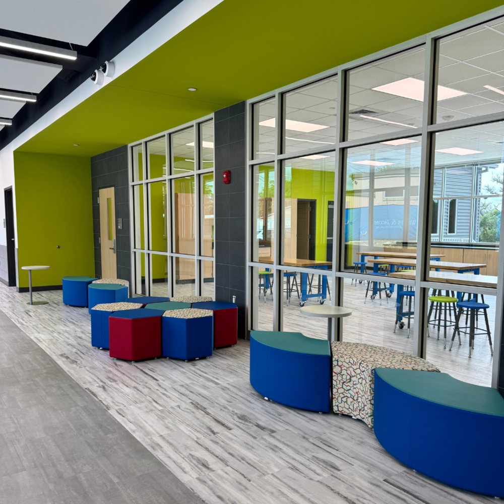 The inside of a school with desks and chairs