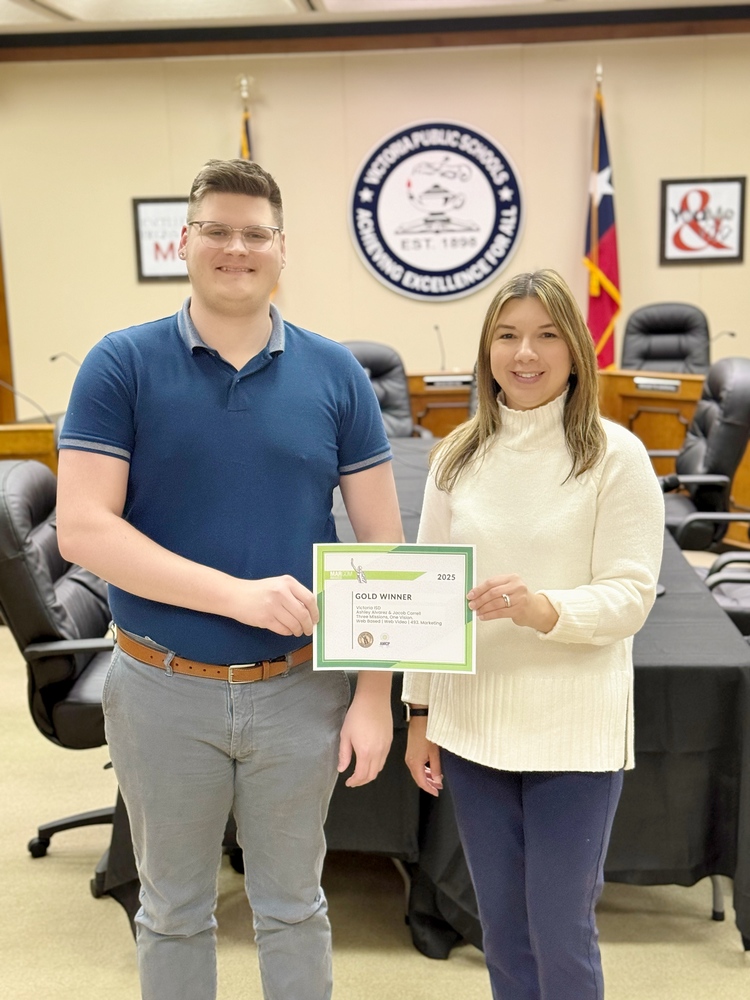 smiling at camera with certificate