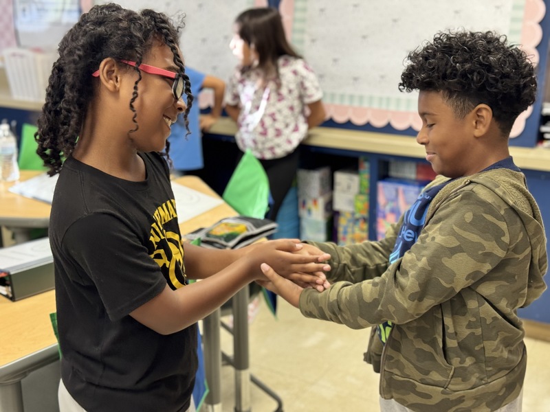Two students engaging in activities  