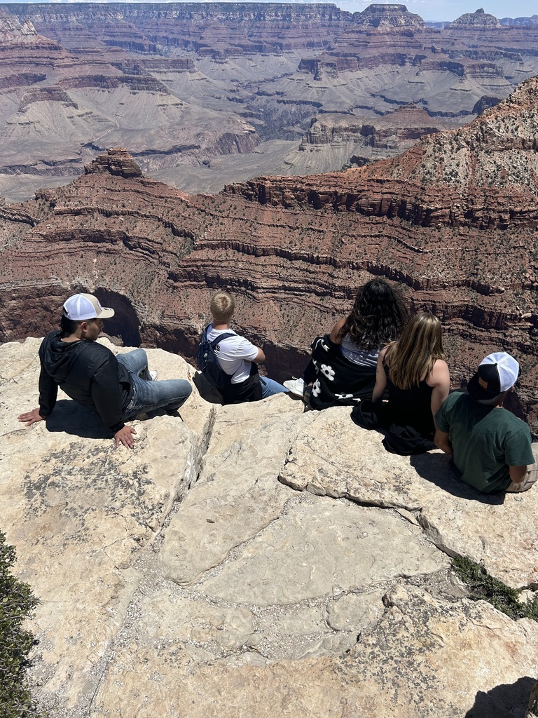 Students posing in front of the Grand Canyon.