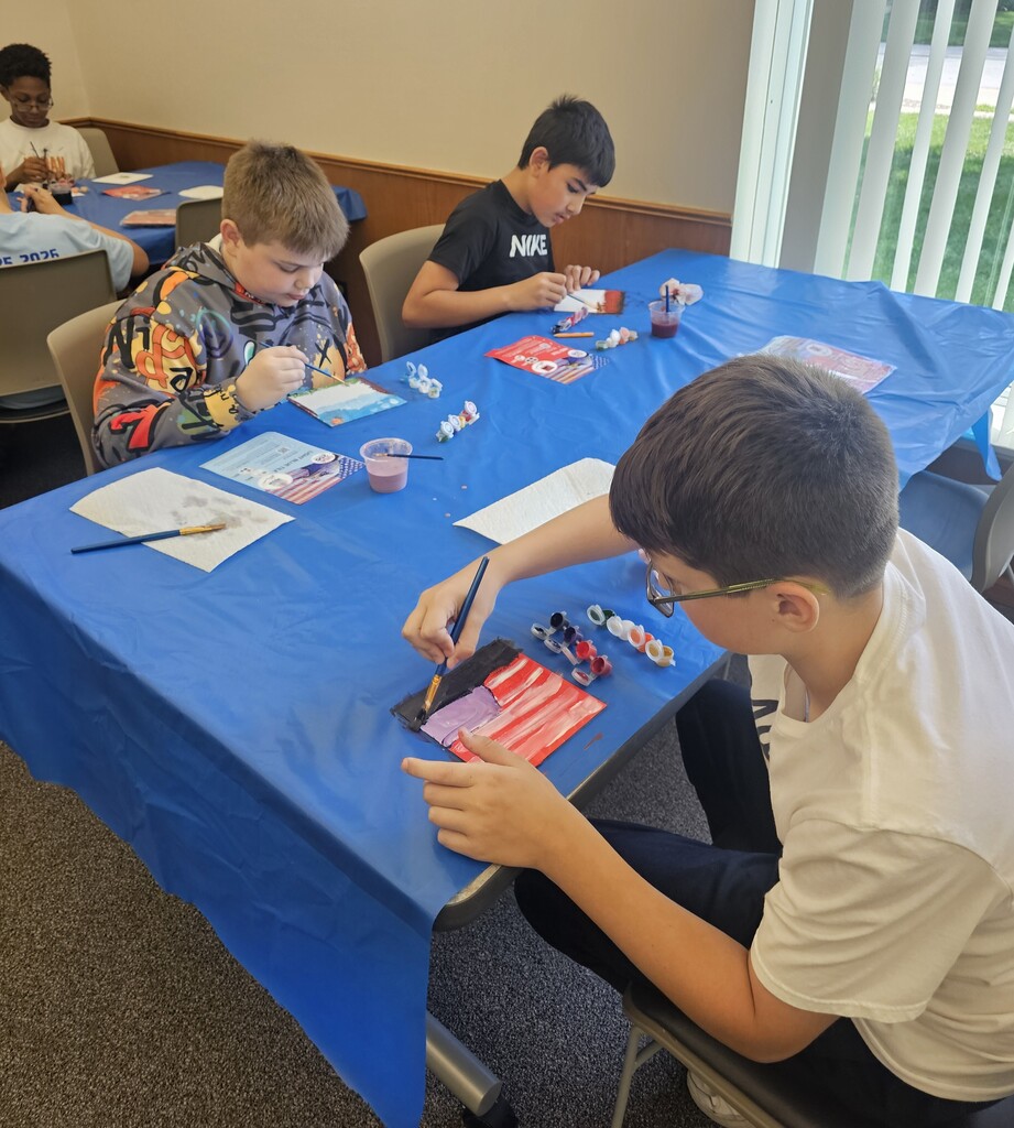Kids painting mural tiles