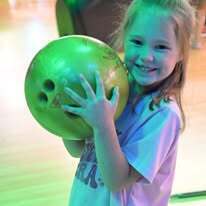 Student holding bowling ball