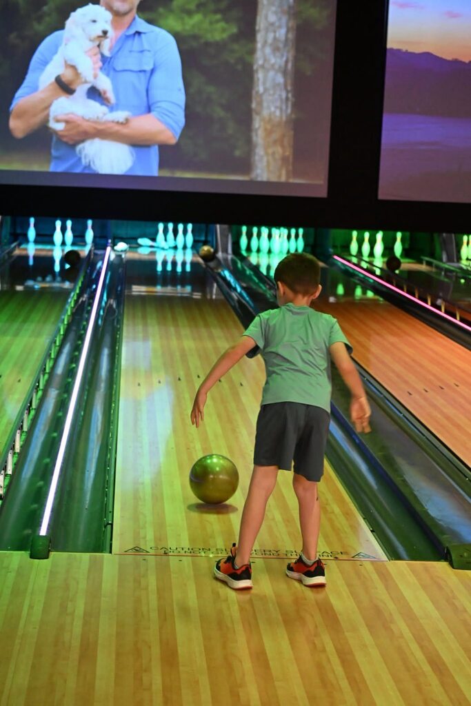 Student watching ball go down the lane
