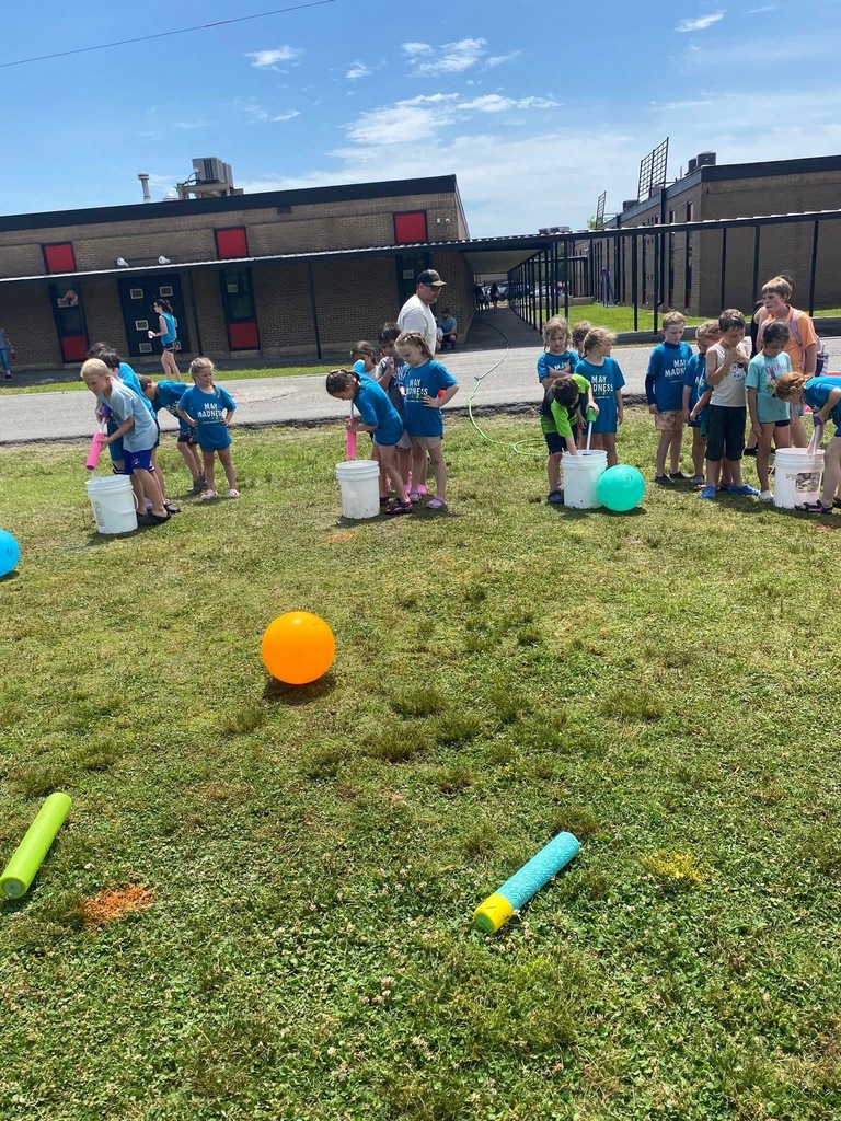 Students playing water squirter game