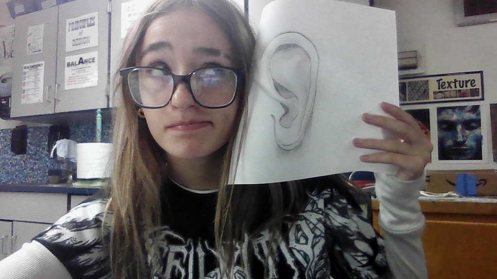 Art club is learning to draw face parts and then faces:)