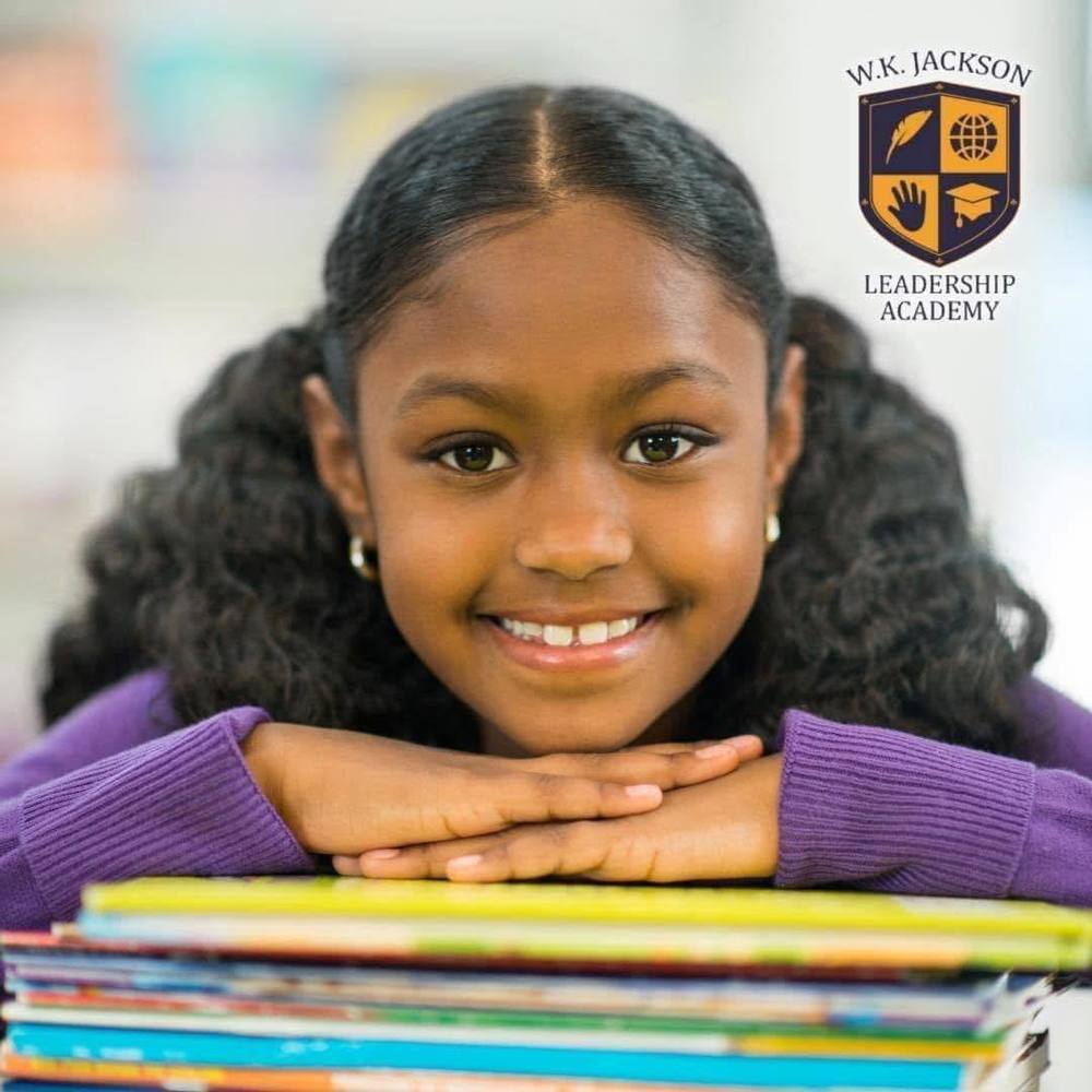 girl with head resting on books