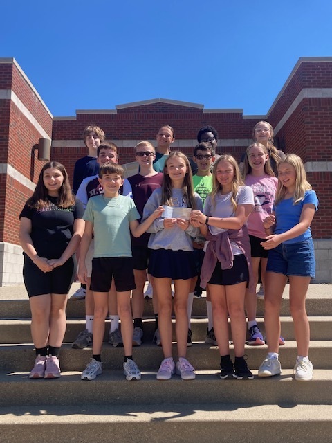 Some members of this year's Varsity choir accepting the grant