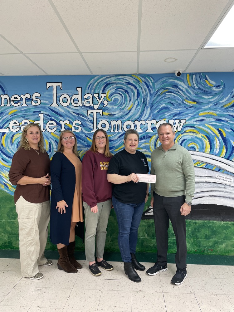 Julie Dickerson of Mt. Carmel Grade School, Laura Taylor of Mt. Carmel Elementary School, Amy Powers of Mt. Carmel High School, Jennifer Betsch of the Eagles and Dr. Chuck Bleyer.