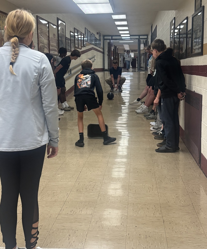 Students participating in experiment in hallway