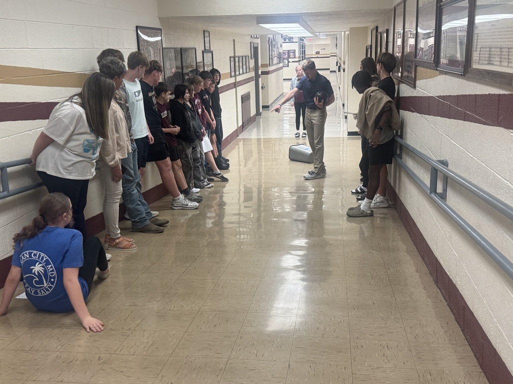 Students participating in experiment in hallway