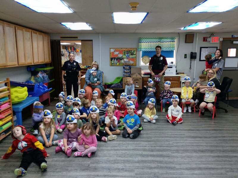 Preschoolers pose with MCPD officers