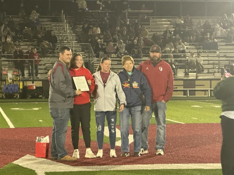 goose hutchens and family getting recognized at football game