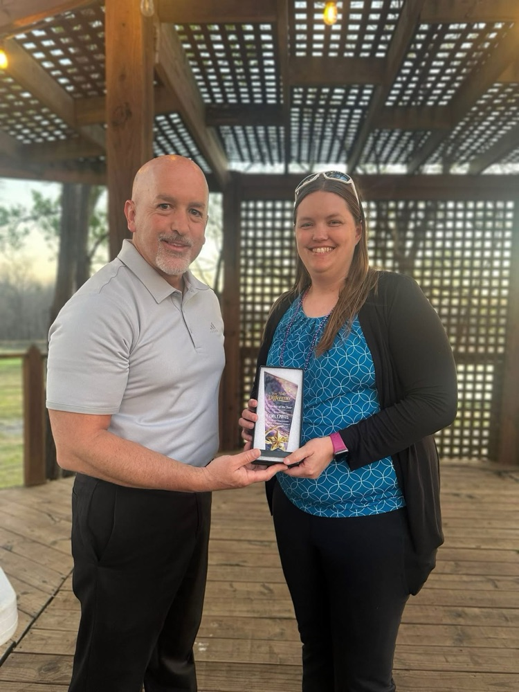 Emily Potts and Jeramy Holmes getting district toy award at chamber of commerce awards ceremony 