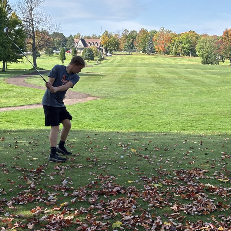 students hitting the ball