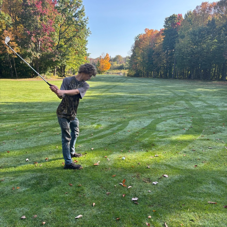 students hitting the ball