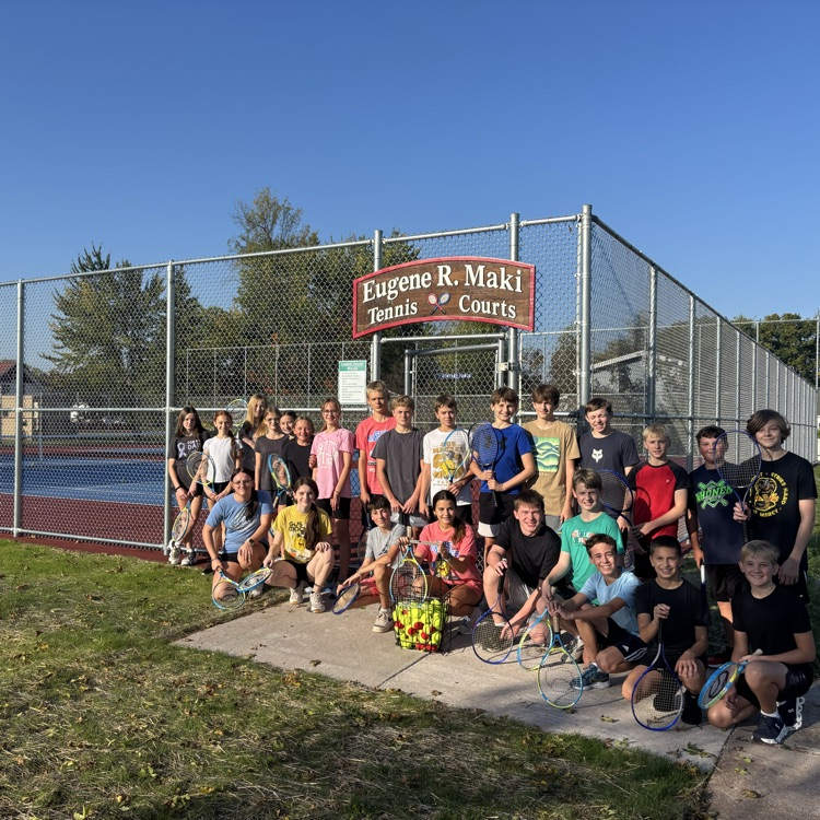 students in front of new tennis courts