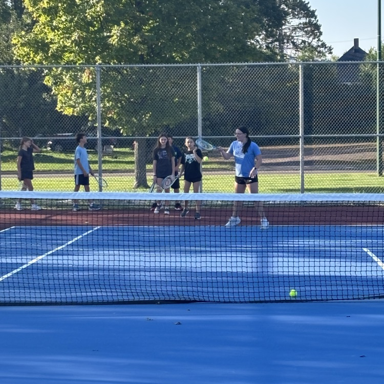 students playing tennis