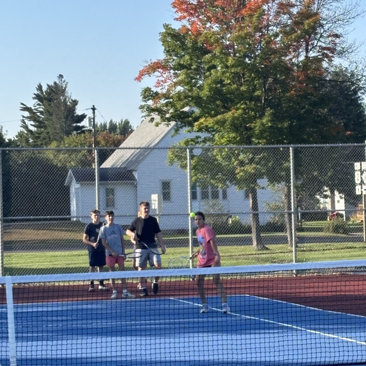 students playing tennis