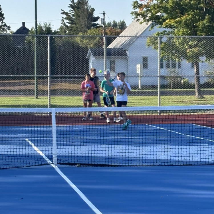 students playing tennis