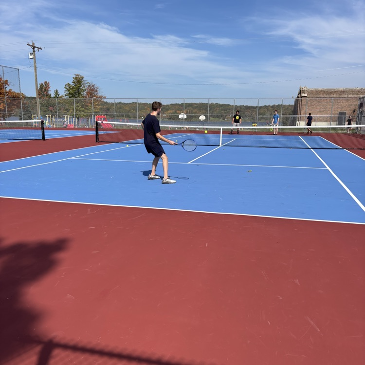 students playing tennis
