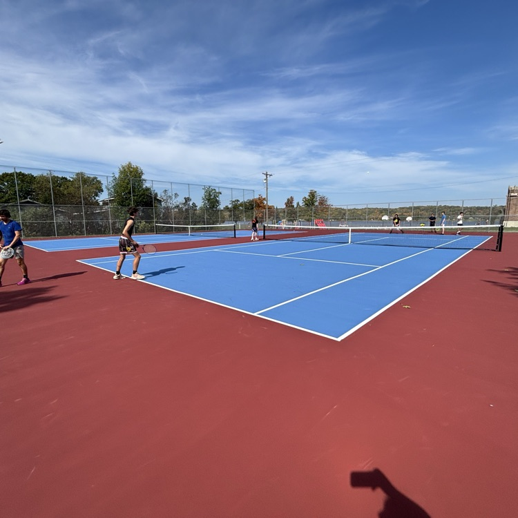students playing tennis
