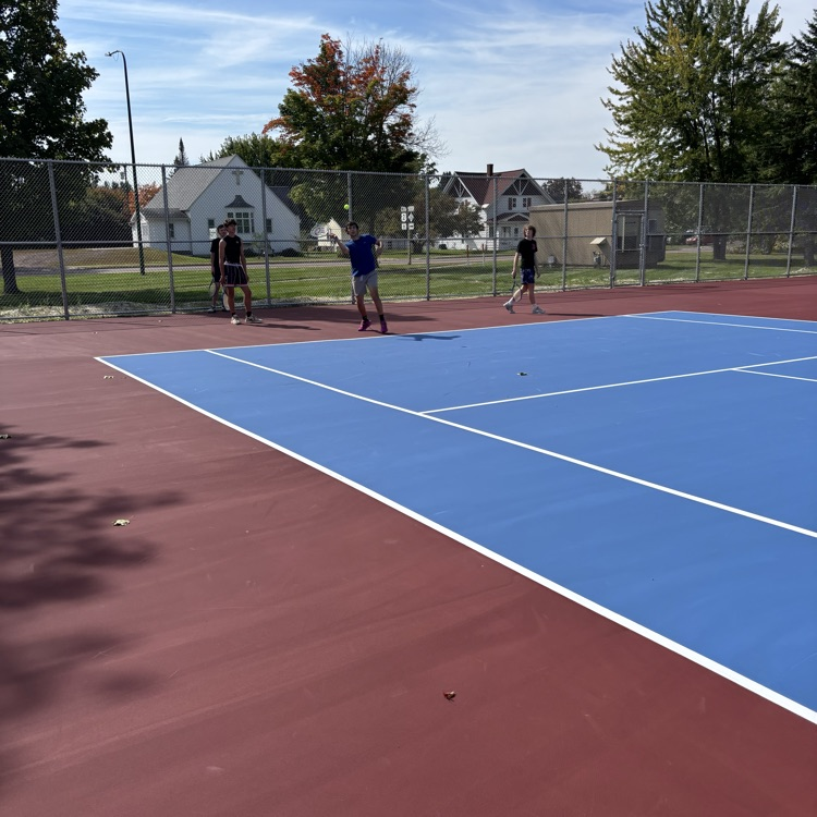 students playing tennis