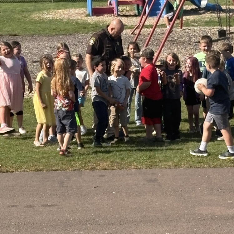 Officer Graser outside with the Elementary kids for lunch hour