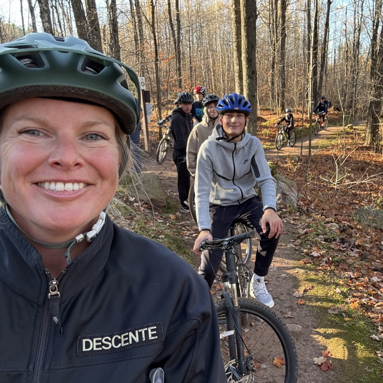 students and teacher biking