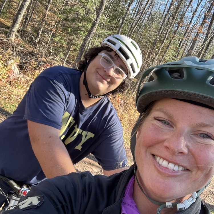 students and teacher biking