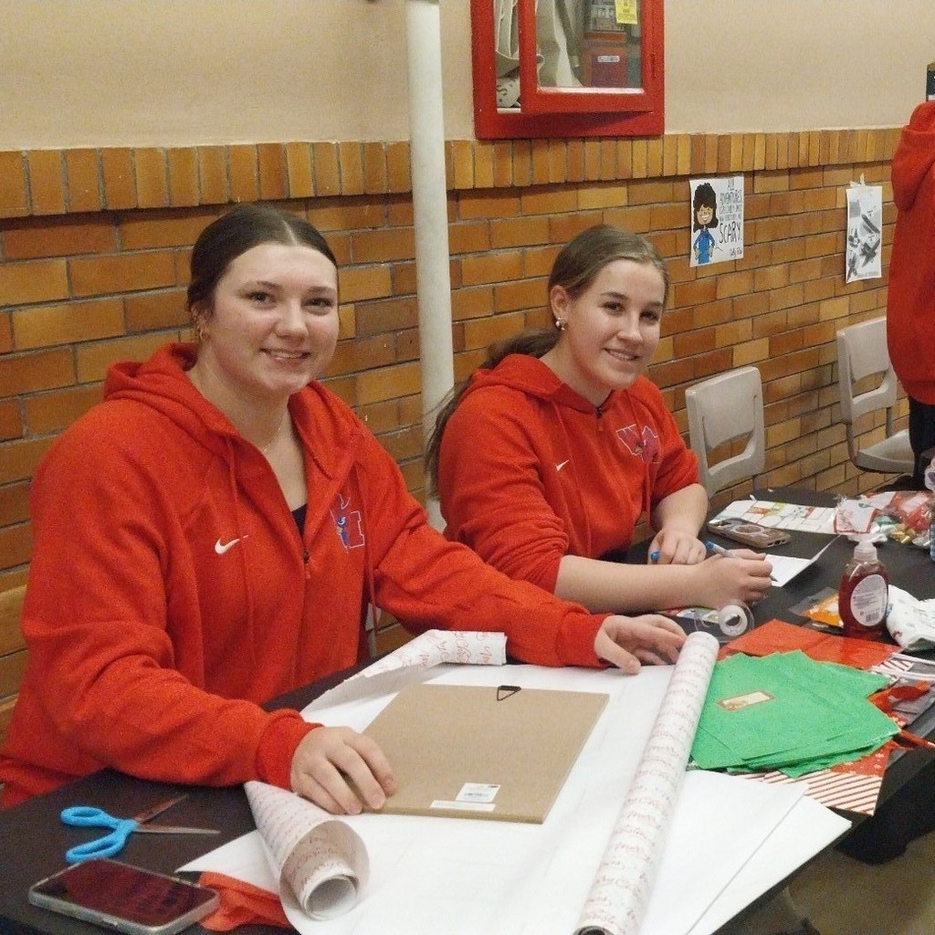 girls wrapping gifts