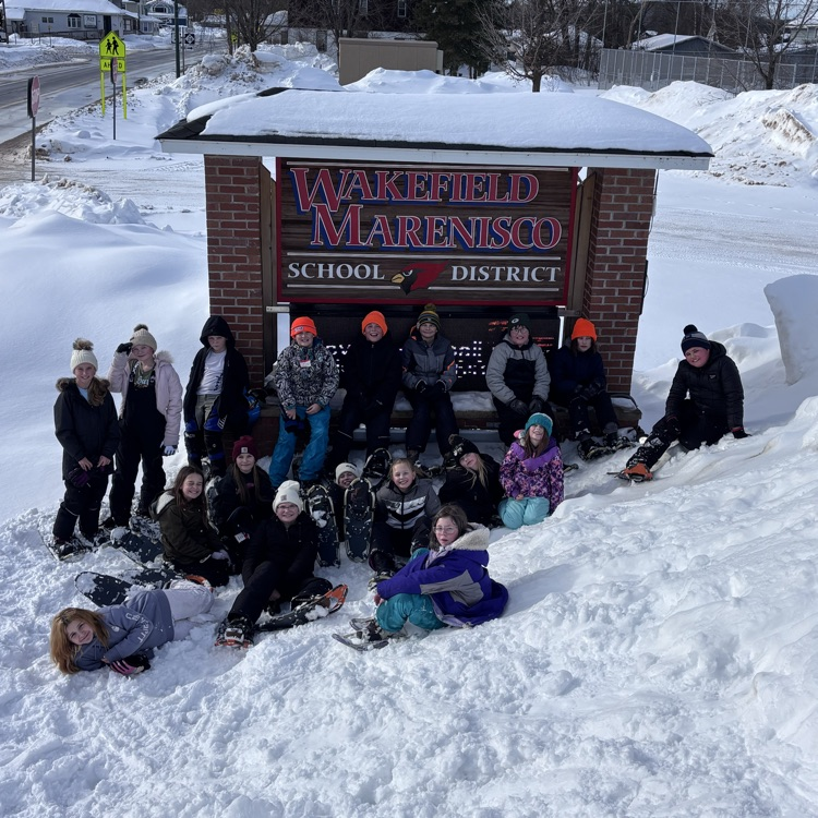 students in front of WM sign