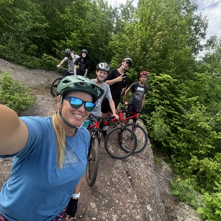 group of students and teacher biking