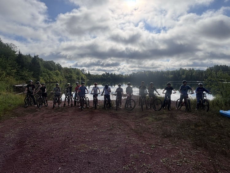 students on bikes by the Little Pit