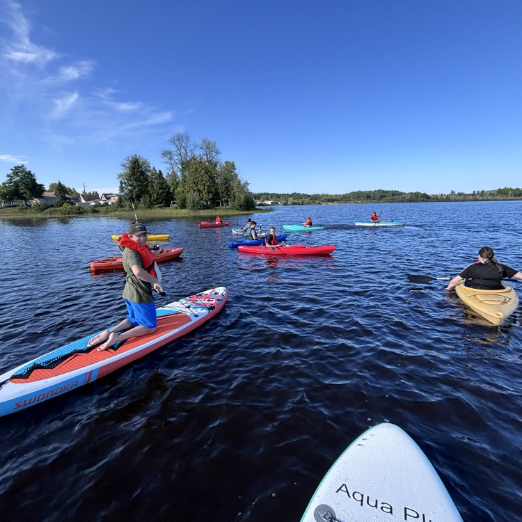 students paddling