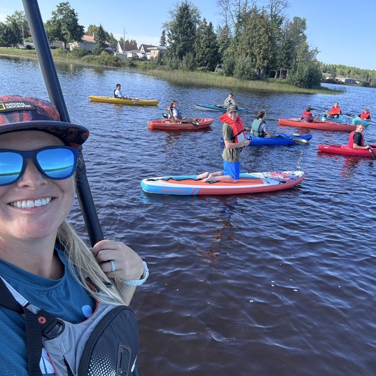 students paddling