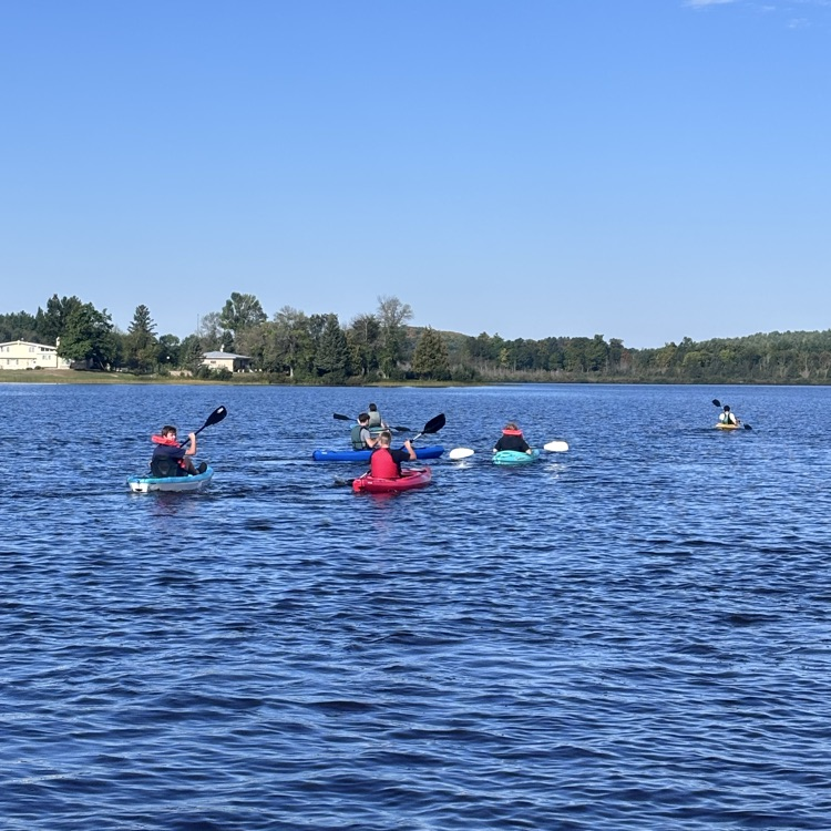 students paddling