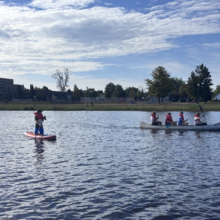 students paddling