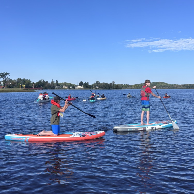 students paddling