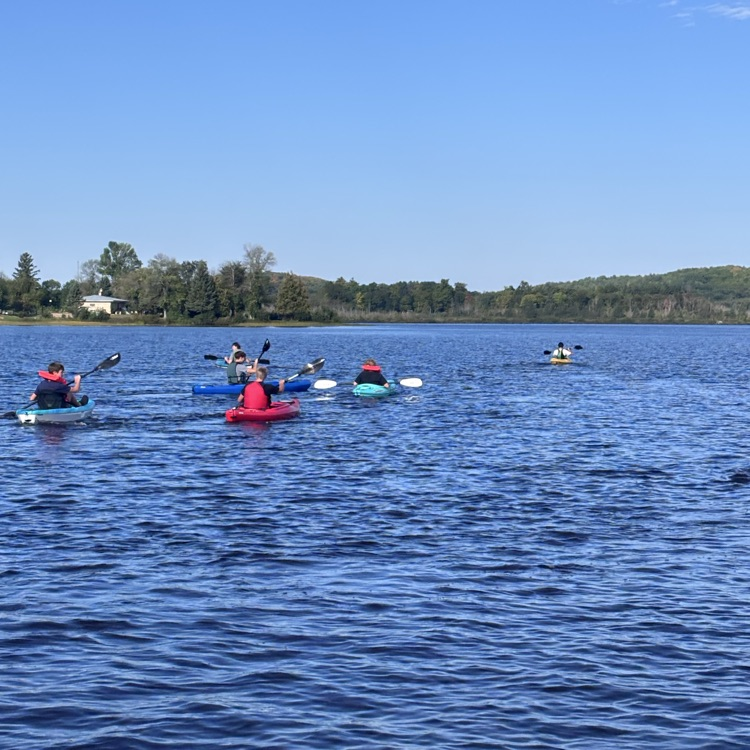 students paddling
