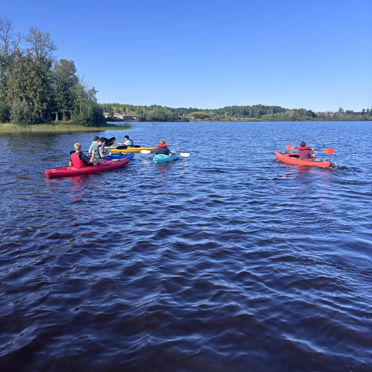 students paddling