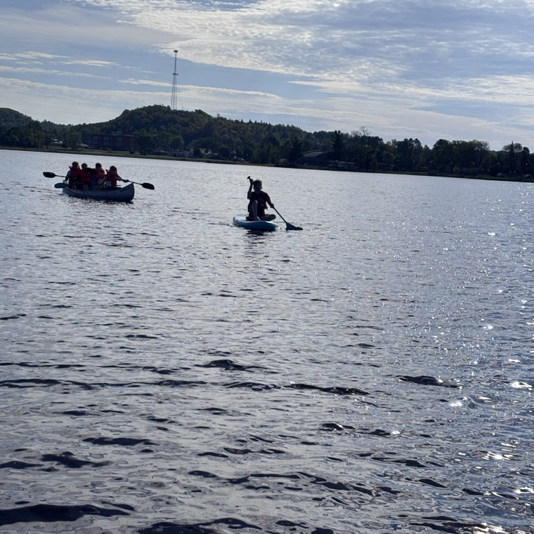 students paddling