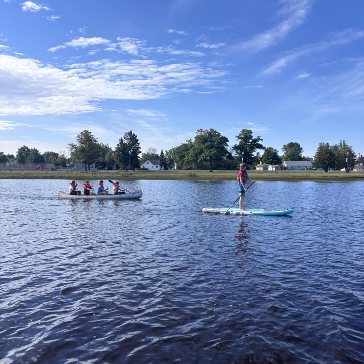 students paddling