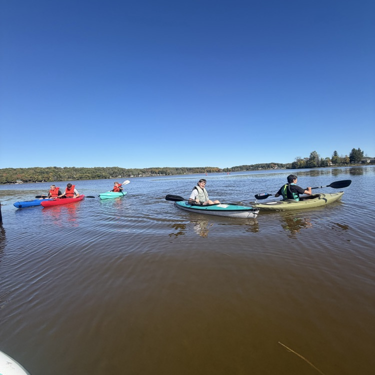 students paddling