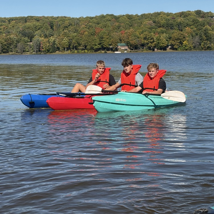 students paddling