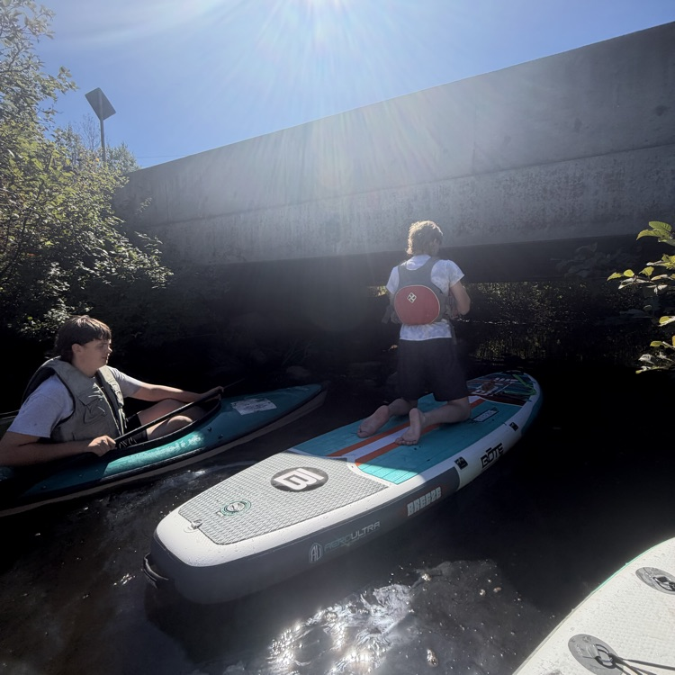 students paddling