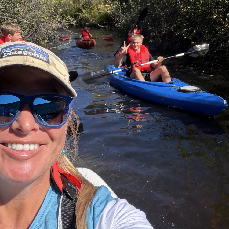 students paddling